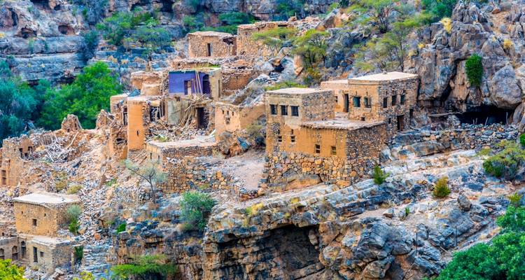 Ancient stone village on a rocky cliffside in Oman.