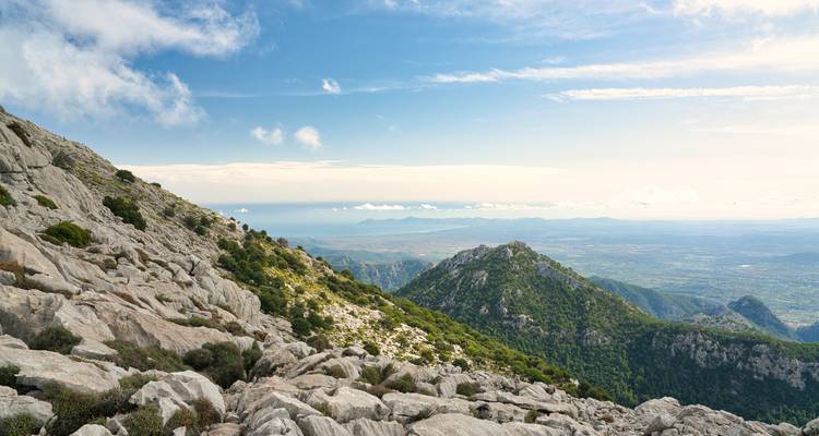 Mountain landscape with rocky terrain and coastal views.