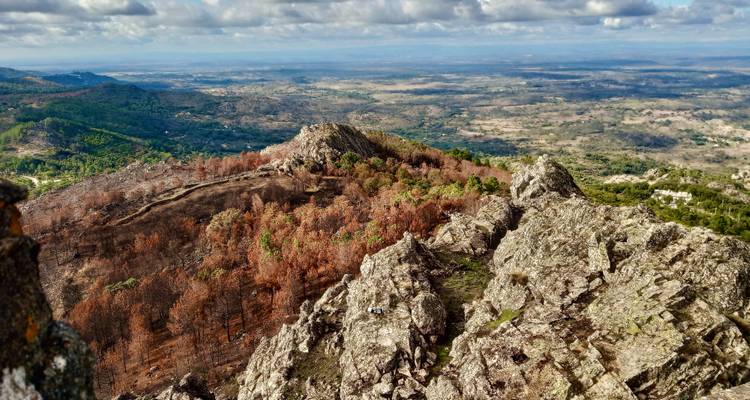 Rocky mountain terrain with a panoramic view of the surrounding landscape.