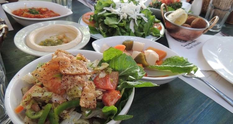 Assorted Middle Eastern dishes including salads and hummus.