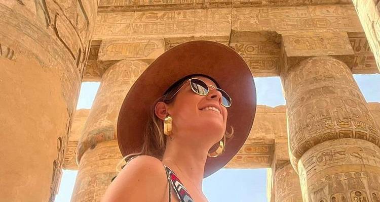 Woman exploring an ancient Egyptian temple.