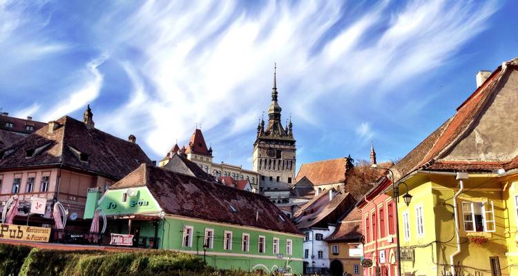 Colorful historic buildings under a bright sky.