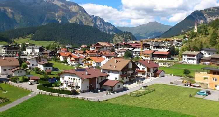 A picturesque mountain village under a clear blue sky.