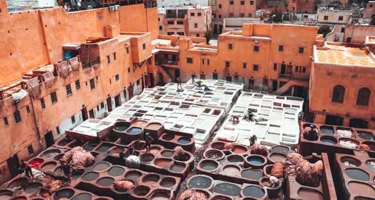 Traditional tannery with colorful tanning pits.