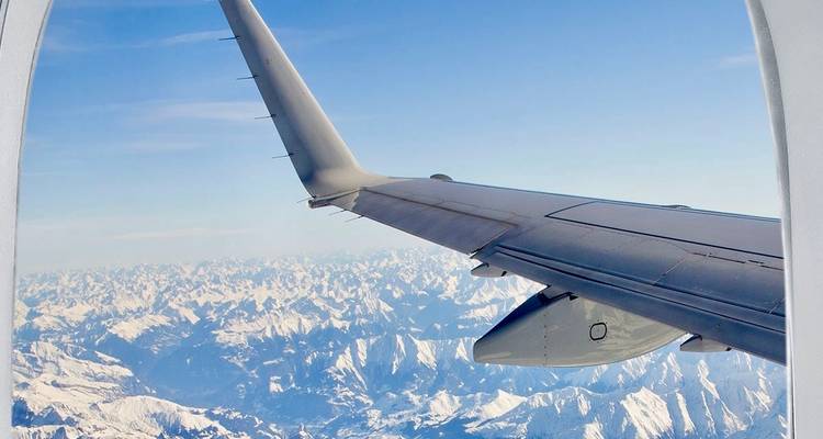 View of a mountain range from an airplane window.