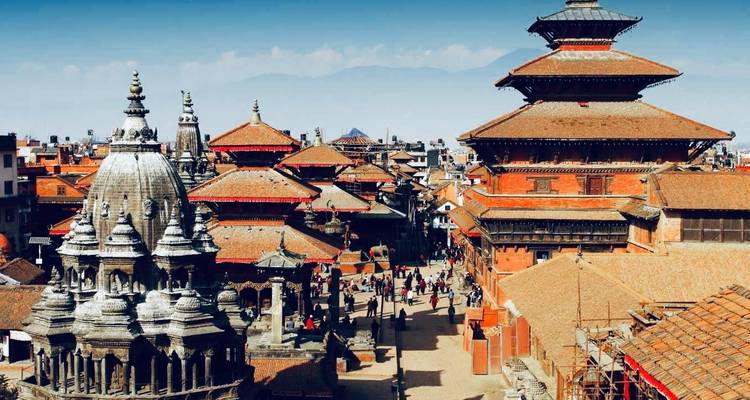 Historic temples with crowded courtyard.