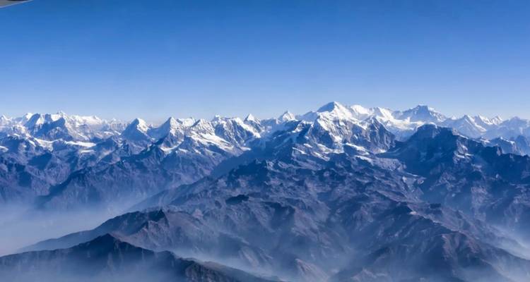 View of mountain range from airplane.