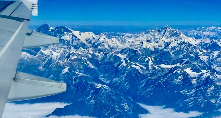 Snow-capped mountain range viewed from above.