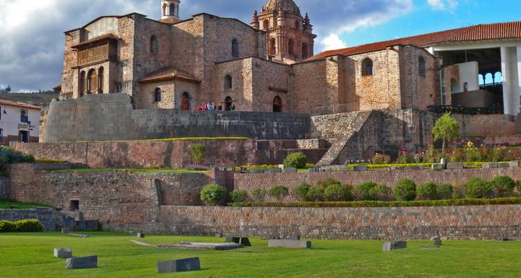 Historical site with gardens and ancient wall in Cusco.