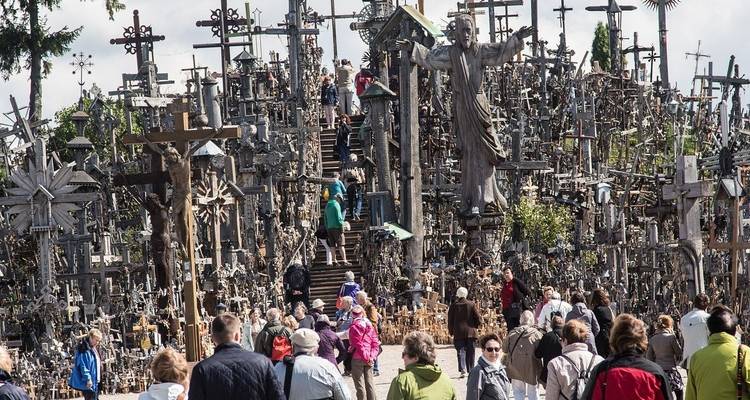 A famous pilgrimage site with a large number of crosses and people.