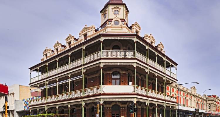 Historic building with intricate architecture at a street corner.