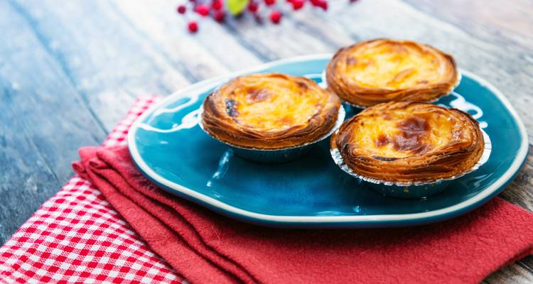 Three custard tarts on a plate