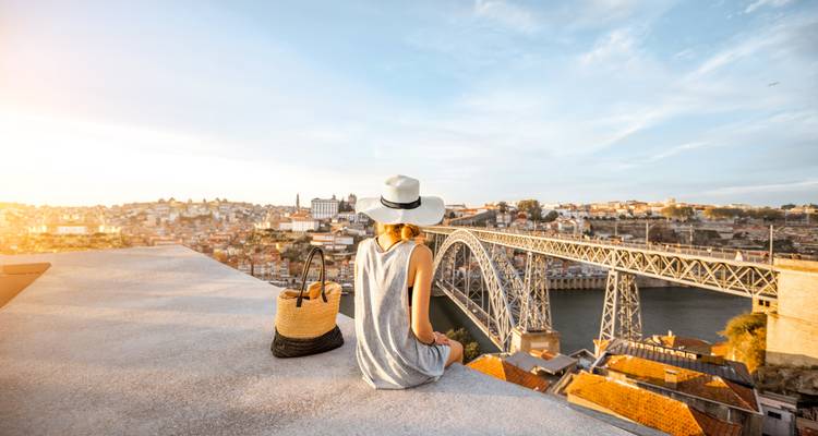 Person overlooking Dom Luís I Bridge in Porto