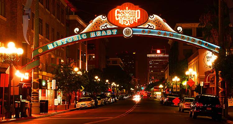 Illuminated entrance sign to the Gaslamp Quarter in San Diego at night.