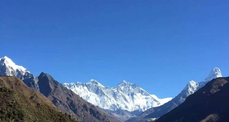 Clear blue sky over majestic Himalayan peaks.