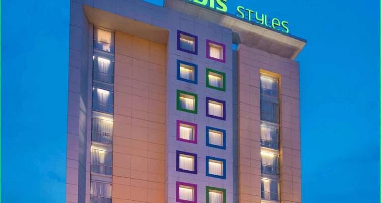 Exterior of a high-rise hotel building at night.