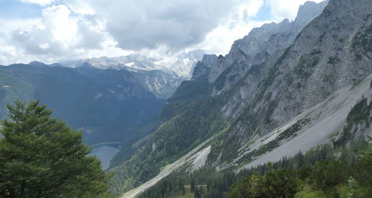 Rugged mountain landscape under a partly cloudy sky.