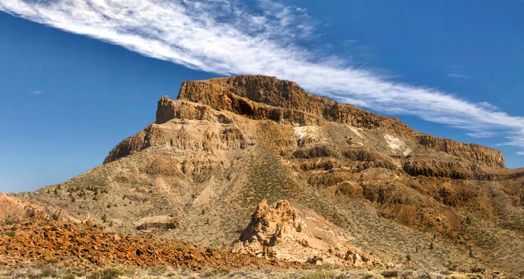 Rocky table mountain with a cloudy sky backdrop.