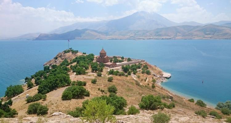 Island with an ancient church surrounded by water.