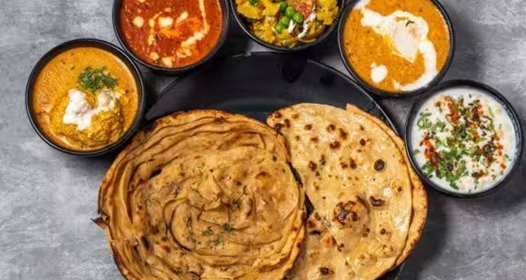 Traditional Indian food with various dishes.