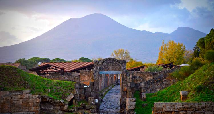 Ancient stone gate with mountain in the background.