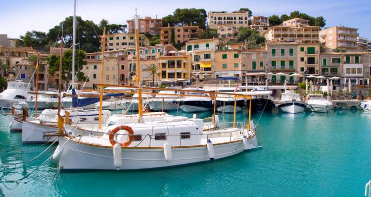 Harbor with boats and colorful buildings.