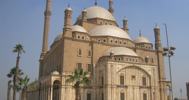 Mosque with multiple domes and minarets.