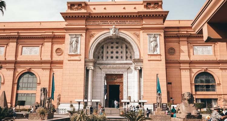 Busy entrance of a large, historic museum.