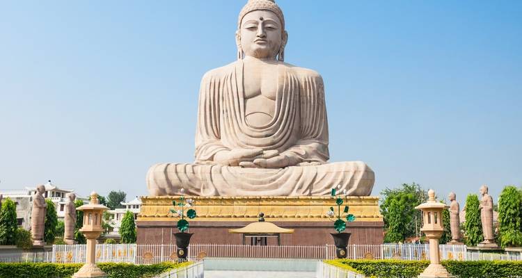Peaceful view of a large Buddha statue in bright sunlight.