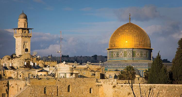 Golden Dome of the Rock shines above Jerusalem's ancient stone skyline.