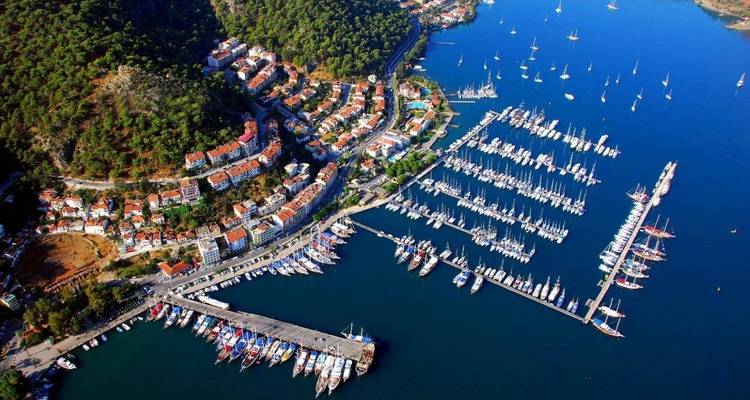 Aerial view of a densely populated harbor with sailboats docked.