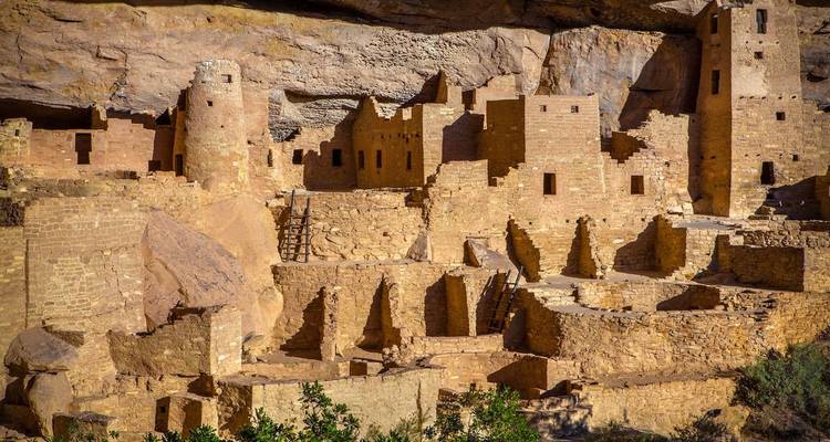 Ancient cliff dwellings built into rock face