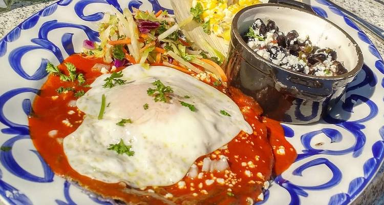 Mexican dish with eggs, beans, and salad