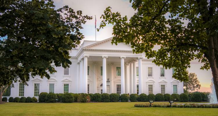 White House with trees in the foreground.
