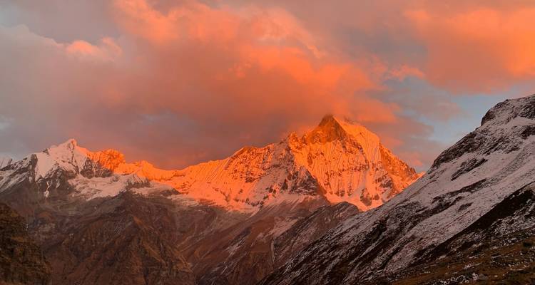 Mountain range glowing in sunset light.