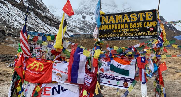 Colorful flags and signs at Annapurna Base Camp.