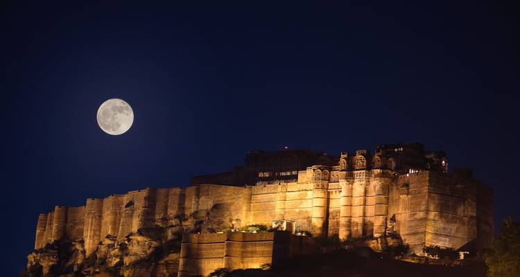 Majestic fort under a moonlit sky.