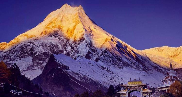 Golden hour on a snow-capped Himalayan mountain.