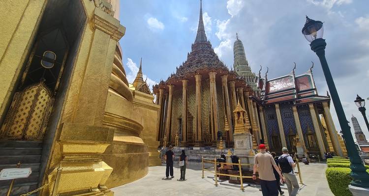 Golden temple with tourists walking around the area.