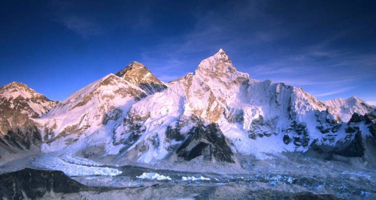 Snow-covered mountain peaks with glaciers.