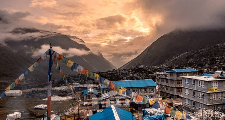 Village with a sunset in a mountain range.
