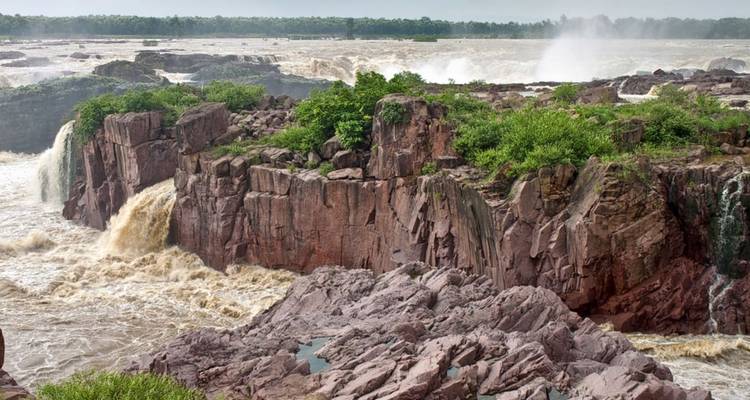 Rugged waterfall surrounded by rocky terrain.