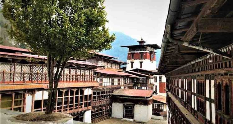 View within a traditional Bhutanese complex with wooden architecture.