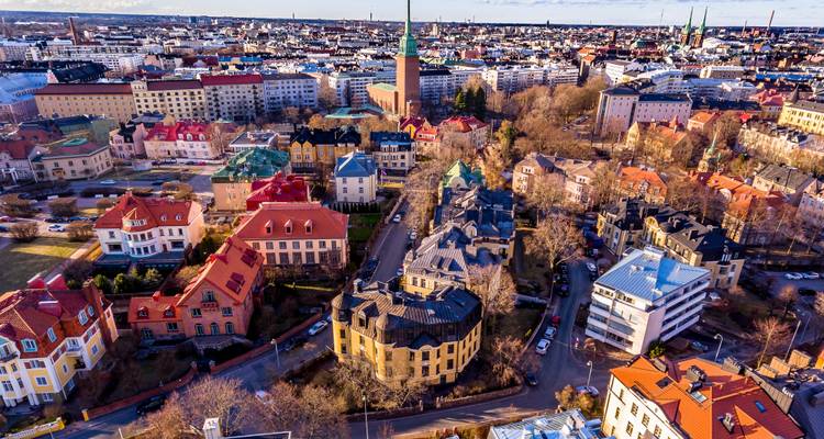 Aerial view of a colorful city with varied architecture.