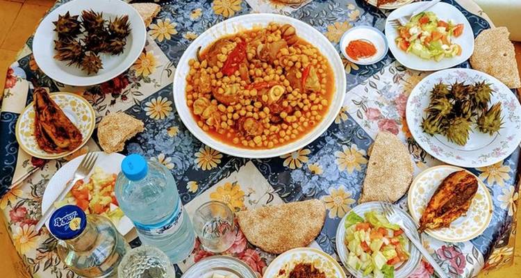 Moroccan meal spread on a table with various dishes