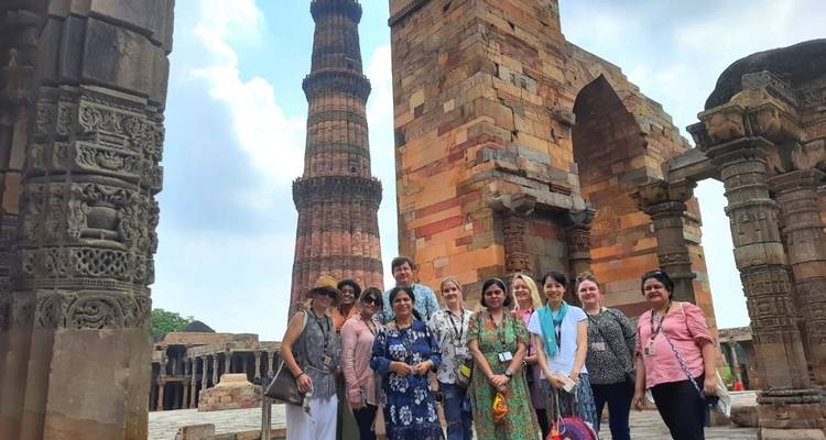 Group of tourists at the Qutub Minar complex.