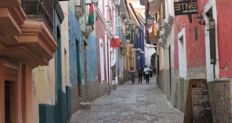 A vibrant street with colorful buildings and people walking.