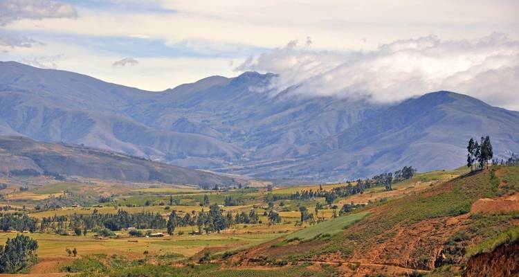 A vast mountain landscape with scattered villages.