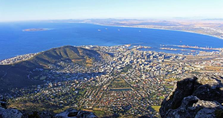 Aerial view of Cape Town with the ocean and Table Mountain.