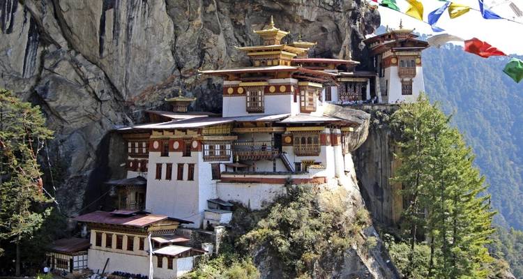 Famous cliffside monastery in Bhutan with prayer flags.
